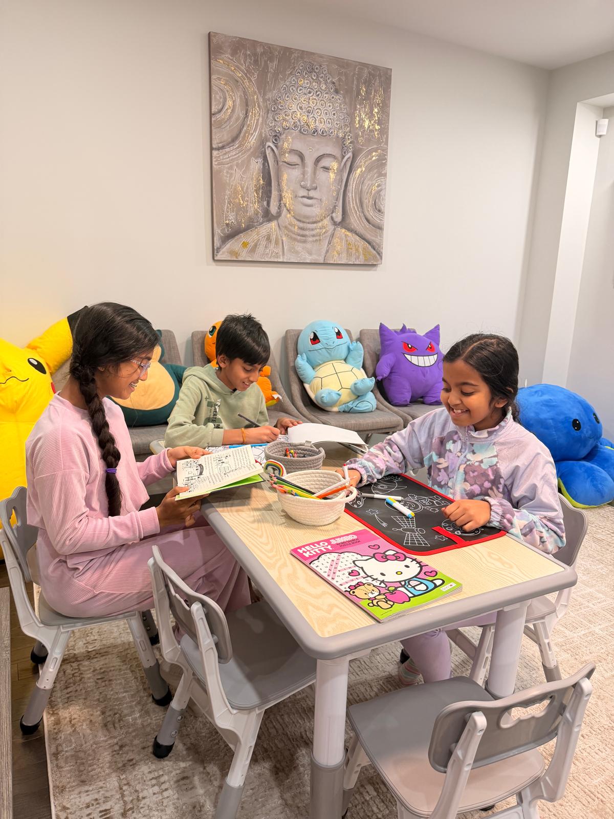 Children reading and drawing during quiet homework time