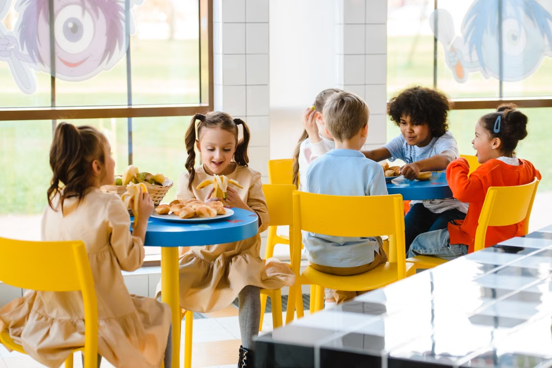 Children enjoying a healthy snack together at a table